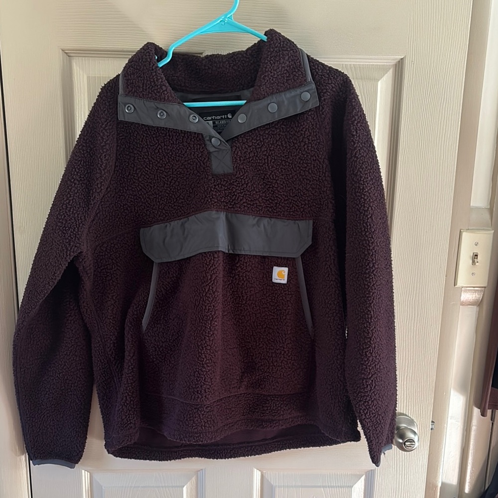 Maroon Carhartt fleece pullover hoodie.